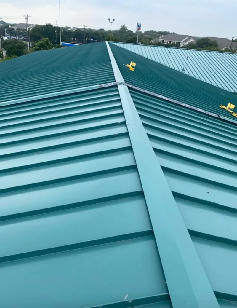 Green commercial metal roof ridge and valley for Metal Roof Repair in Mason